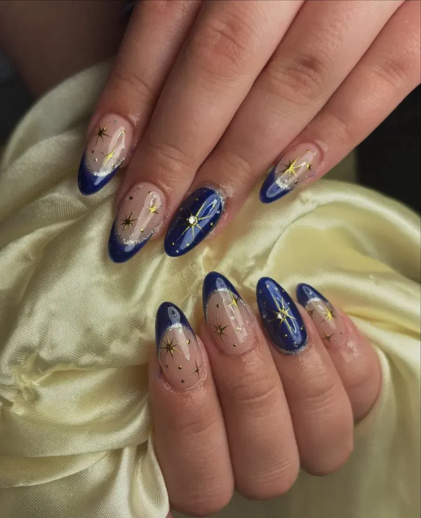 Deep Blue French Tip Nails With Gold Star Accent Details