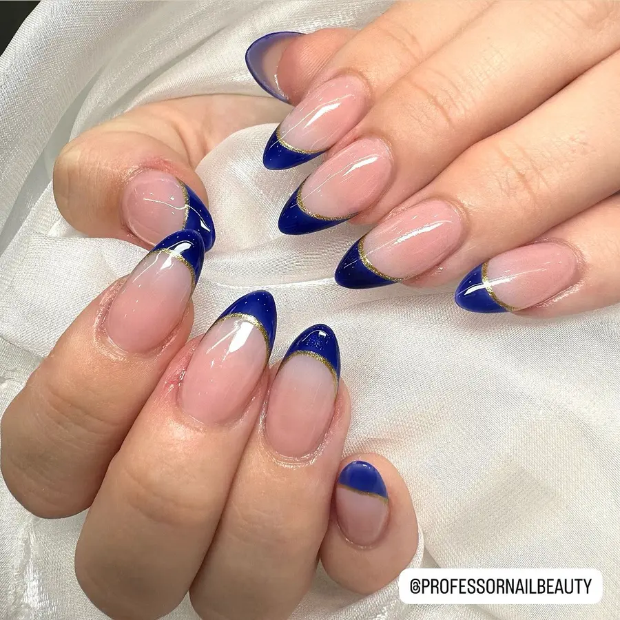 Glossy Nude Nails With Deep Navy Curved Tips and Gold Detail