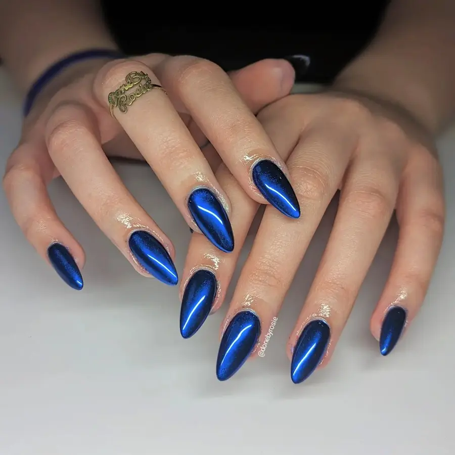 Deep Blue Chrome Stiletto Nails With High-Gloss Drama