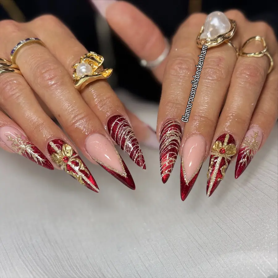 Dramatic Red and Gold Stiletto Nails With Sculpted Metallic Details