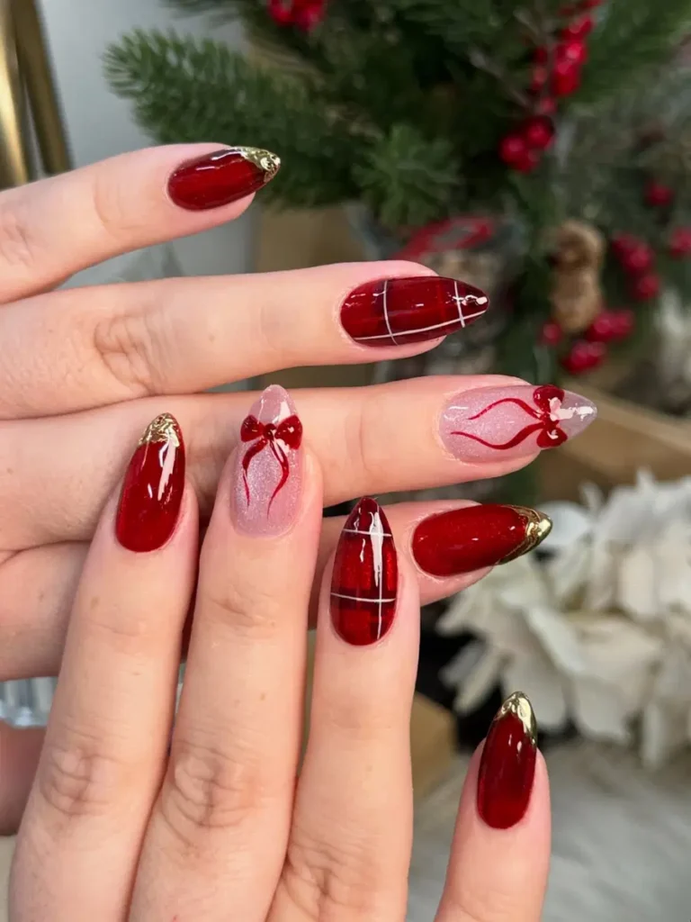 Glossy Red Almond Nails With Fine Gold Tips and Delicate Line Art