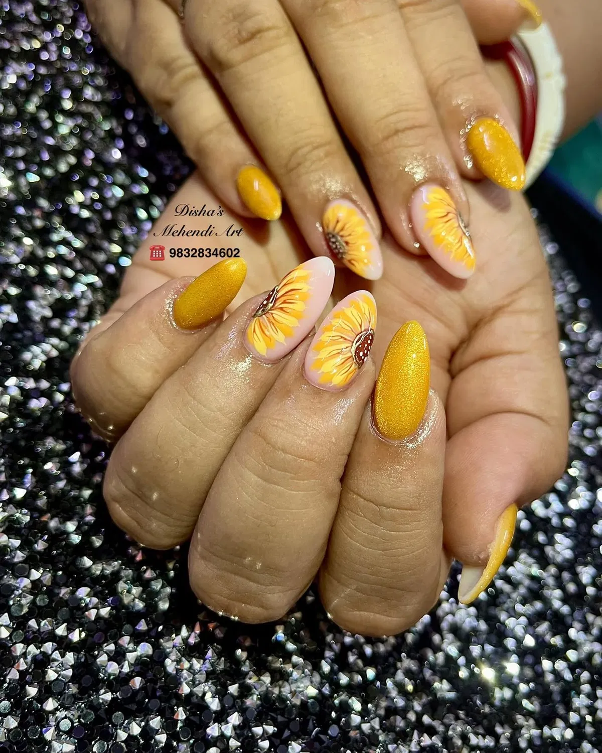 Yellow shimmer nails with large floral accents