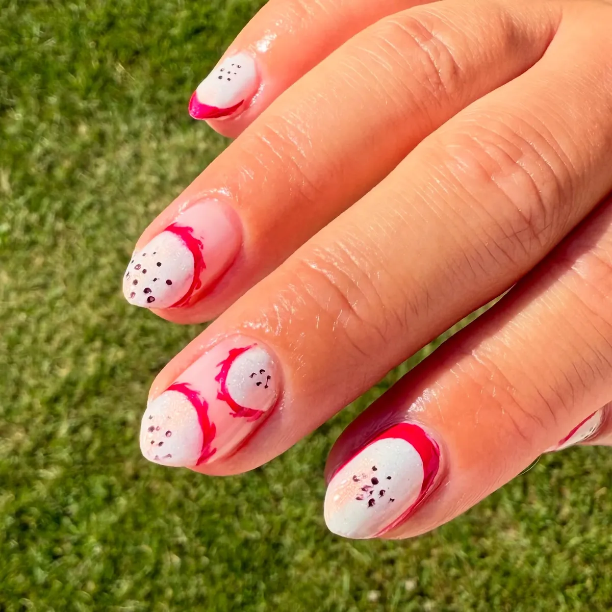 Red Curved Tips with Black Speckles on White Base