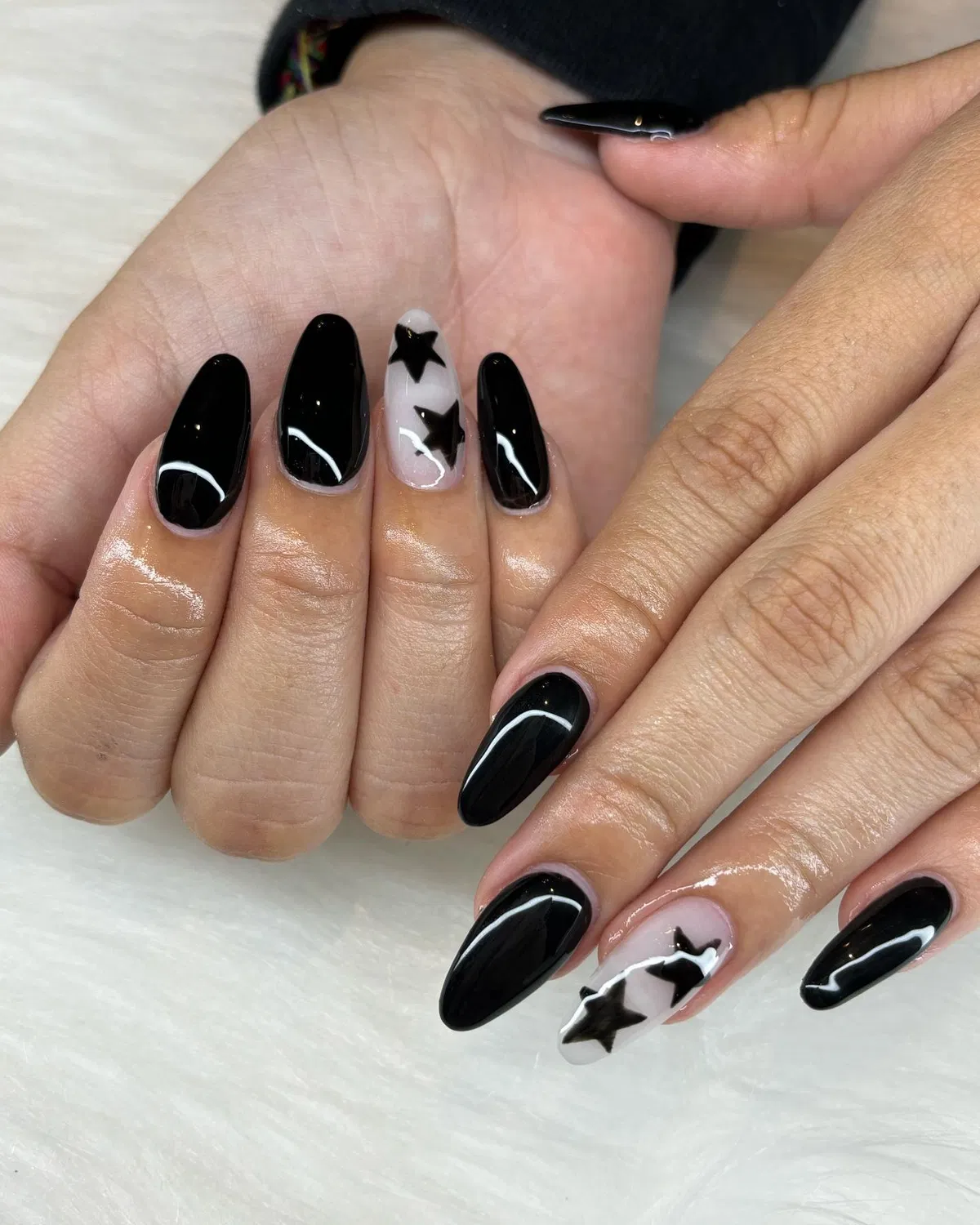 Solid black nails with large black star accent nails