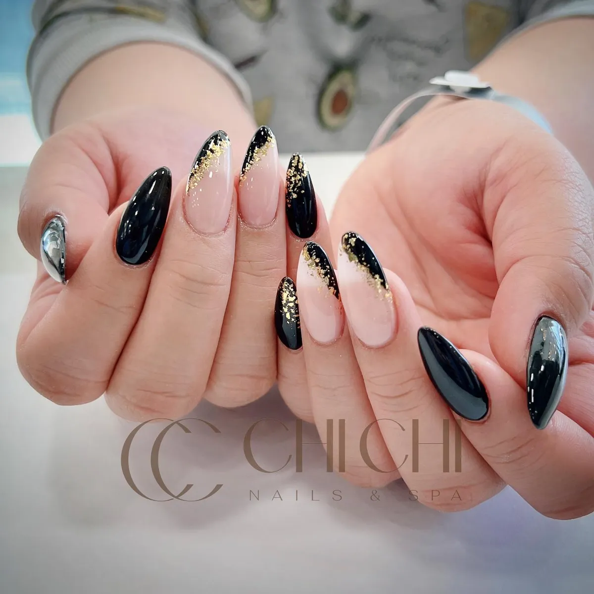Glossy black and nude with gold-flecked black tips
