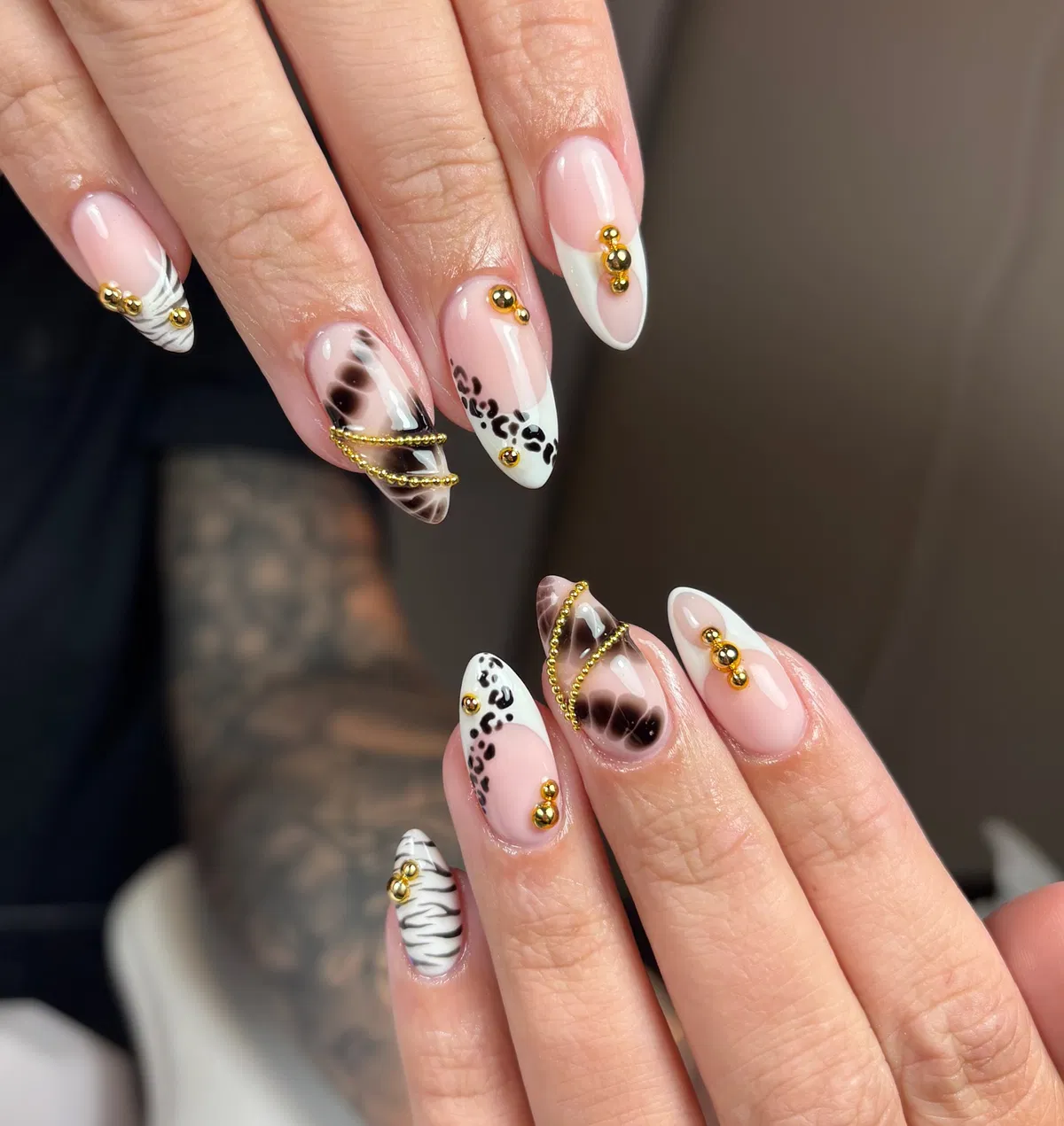 Nude base with black animal print and gold studs