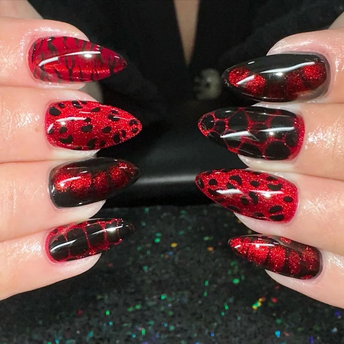 Red glitter base with black patterned overlays