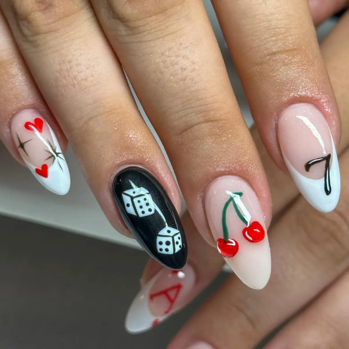 Dice, hearts, and cherries on nude-and-white tips