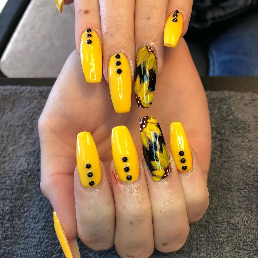 Glossy yellow set with black dot accents and floral-painted black accents