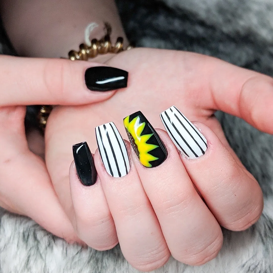 Black-and-white stripes with a bold yellow-on-black accent