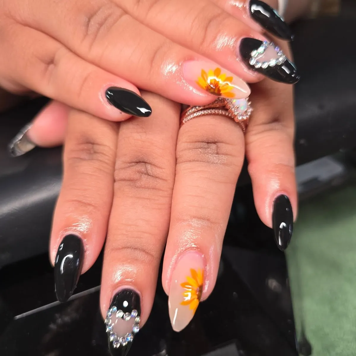 Glossy black with nude floral accents and heart outlines