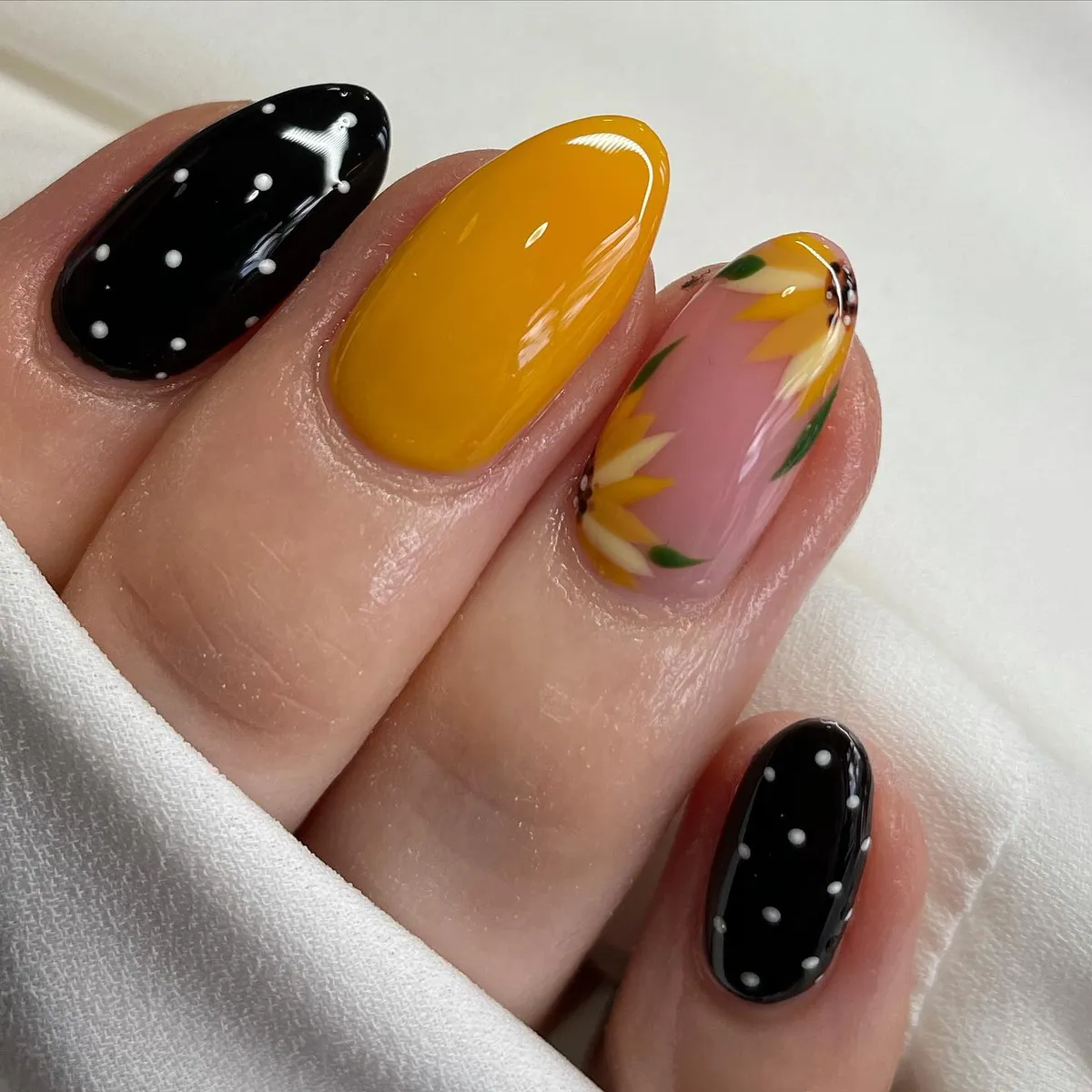Polka-dot black with mustard yellow and a pink petal-border accent