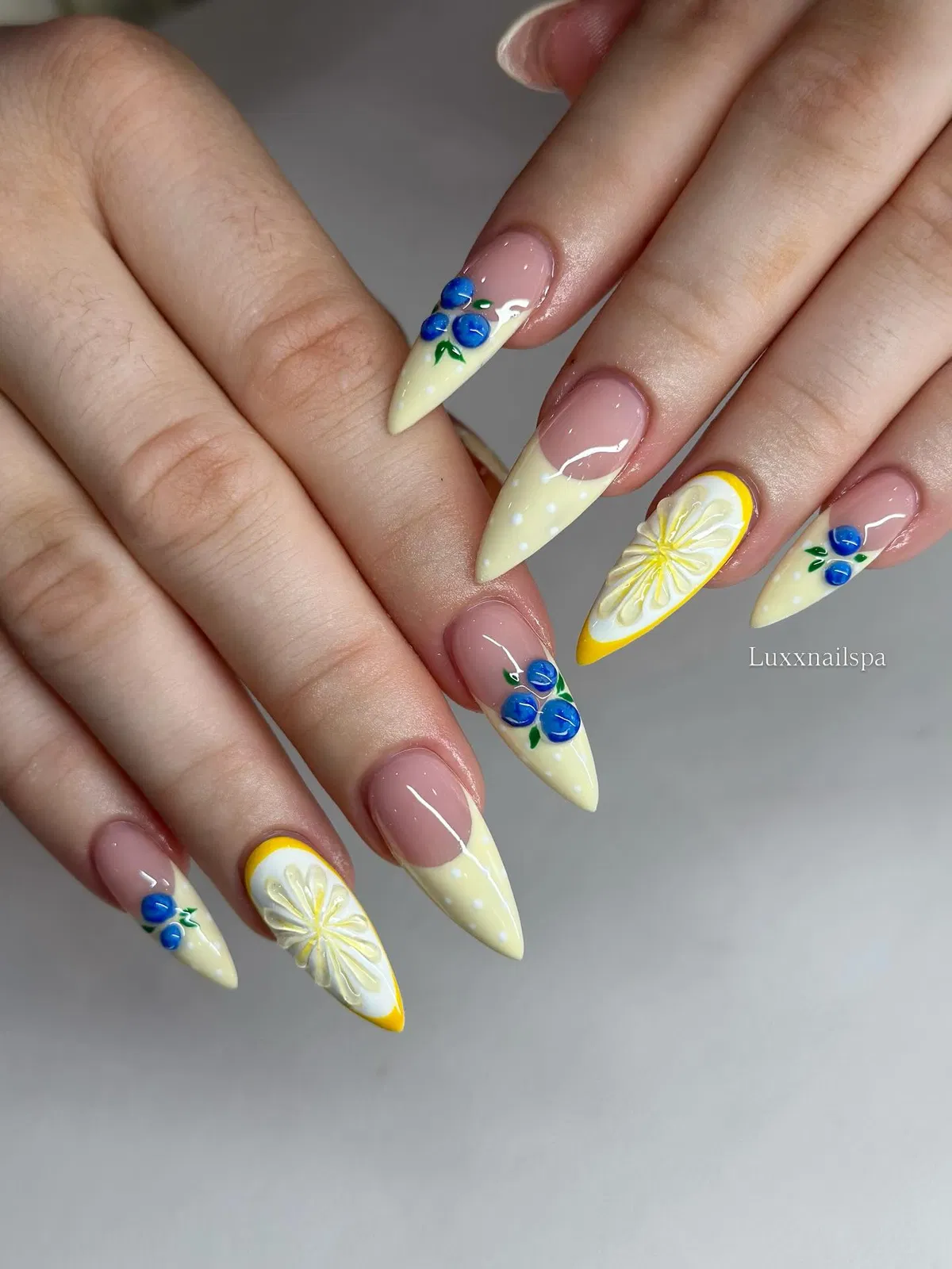 Pointed pale-yellow tips with blue accents and raised lemon slices