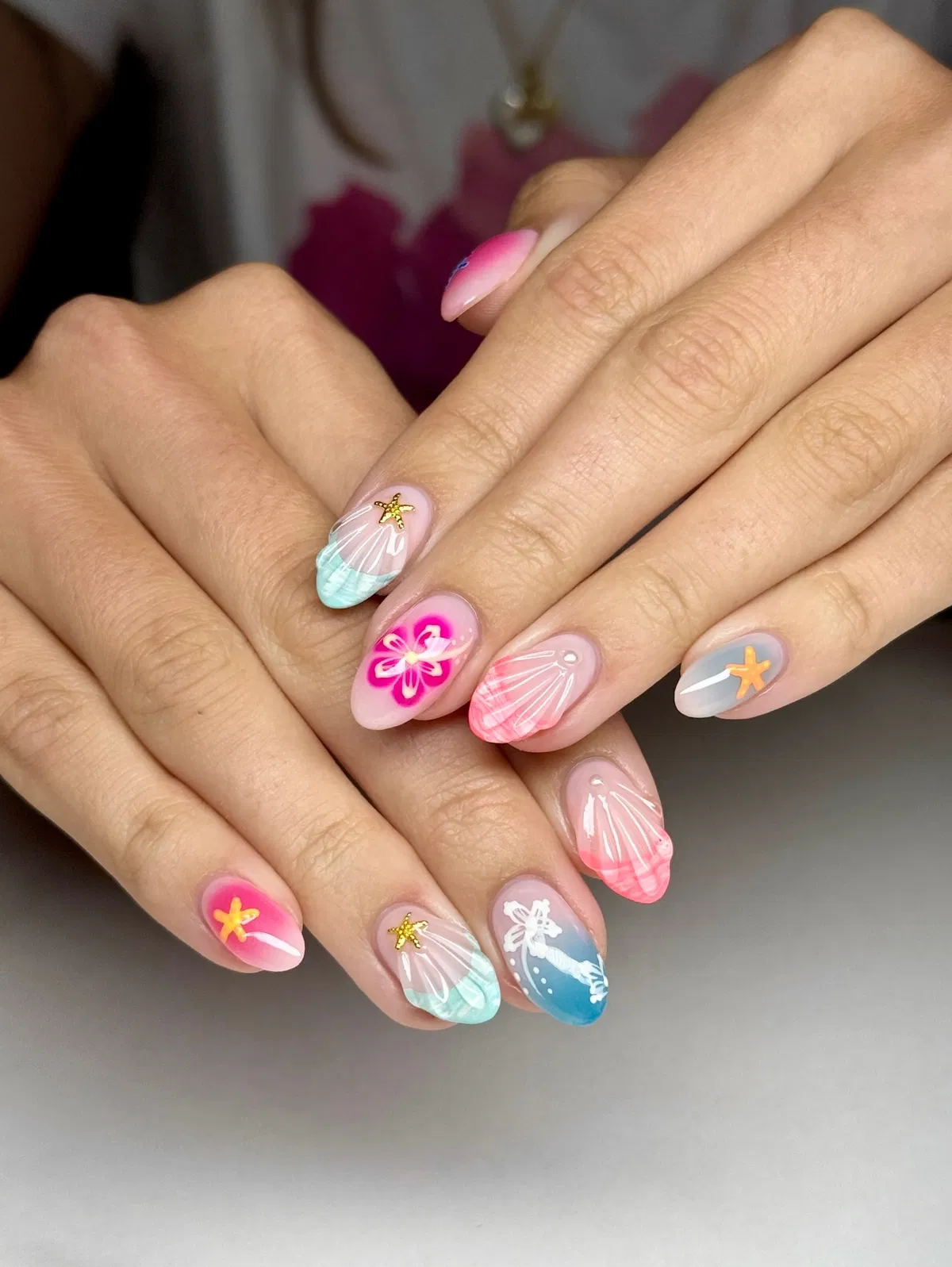 Pastel shell line art with starfish and floral accents