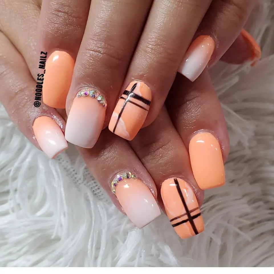 Peach tones with black line grid and rhinestone cuticles