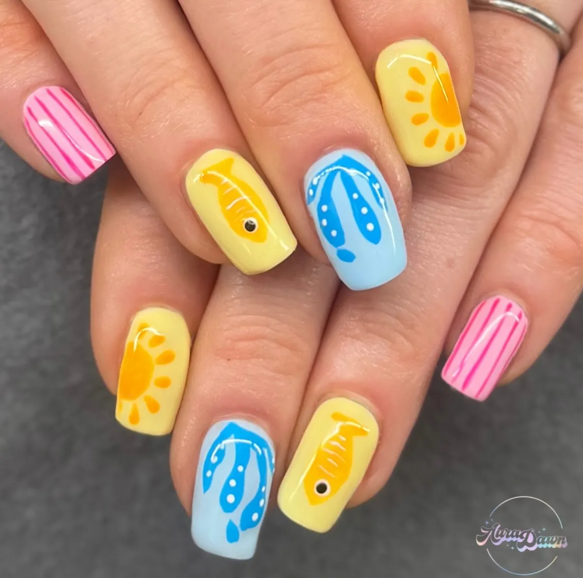 Pastel graphic icons: stripes, sun, fish, and flip-flops
