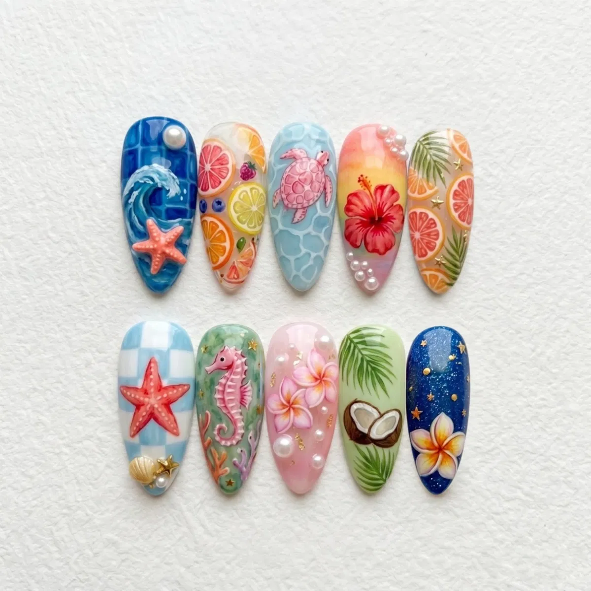 Detailed nail-tip set with sea life, citrus, and florals