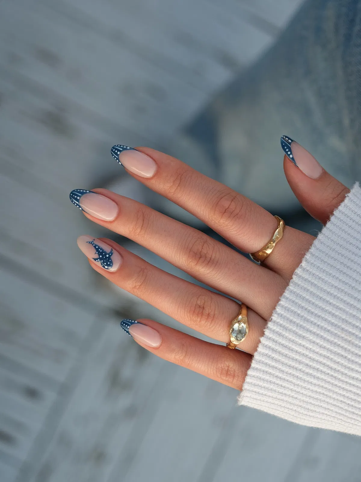 Dark blue dotted French tips with fish silhouette