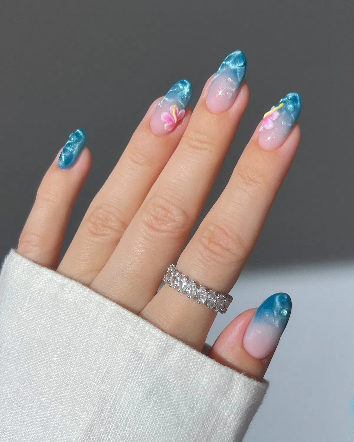 Teal gradient tips with raised floral accents