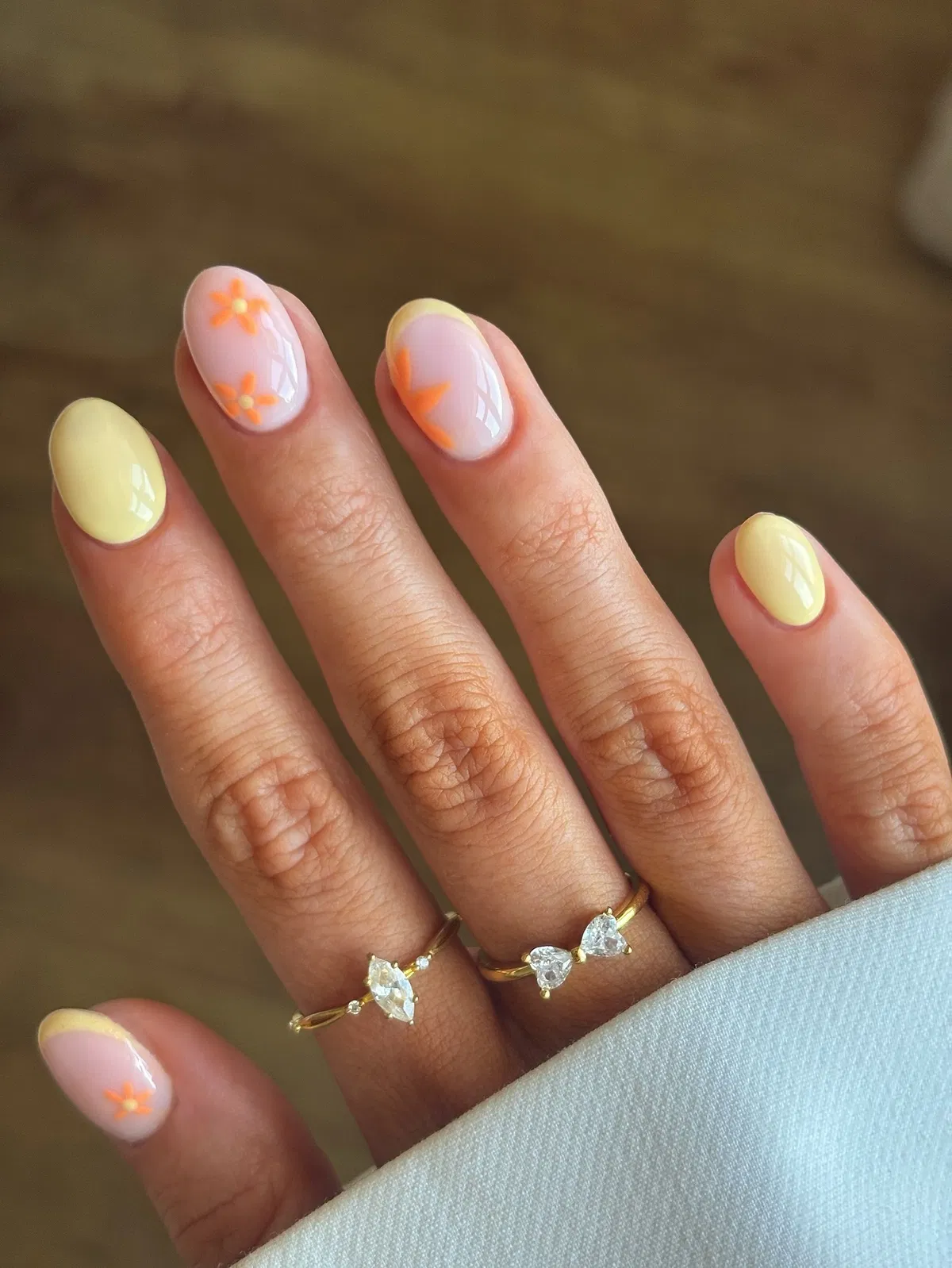 Pastel yellow with simple orange floral accents
