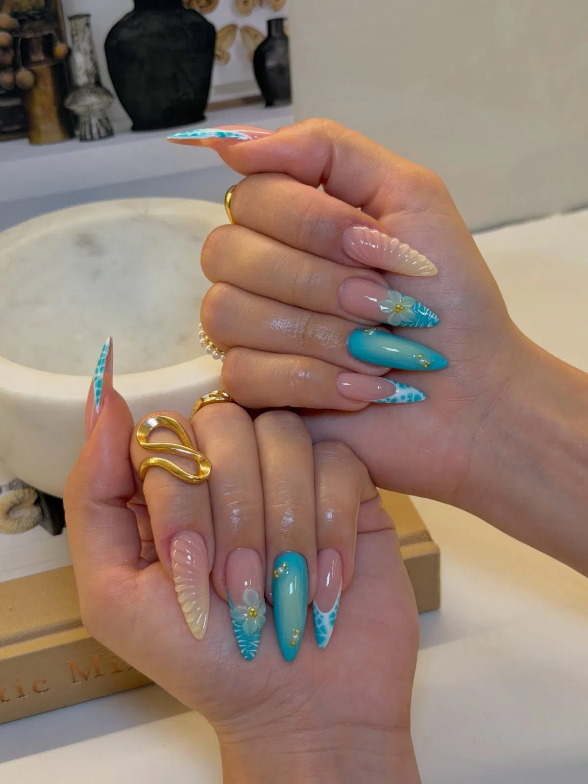 Turquoise stiletto set with grid tips and raised flowers
