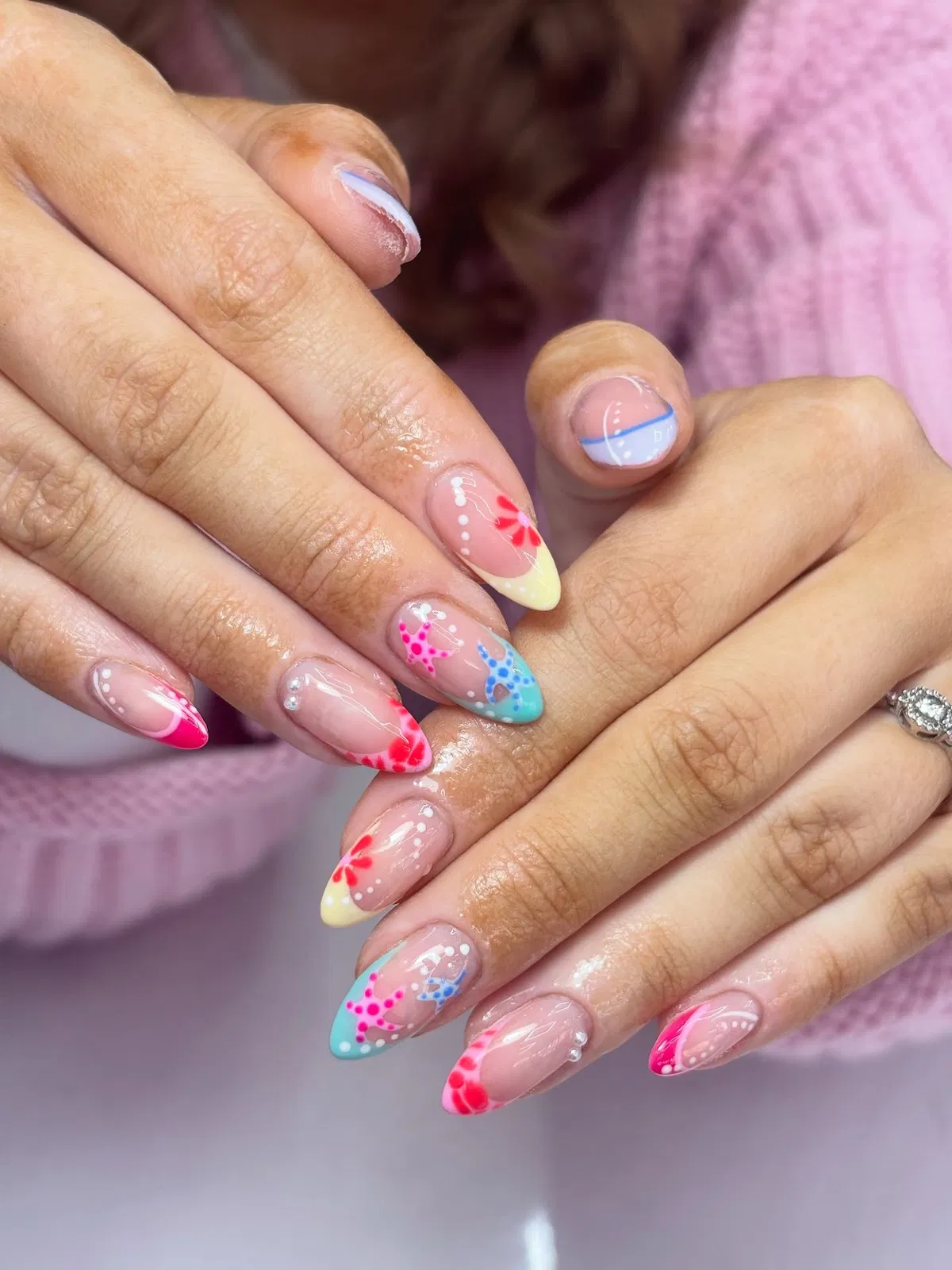 Colorful French tips with starfish and pearl accents