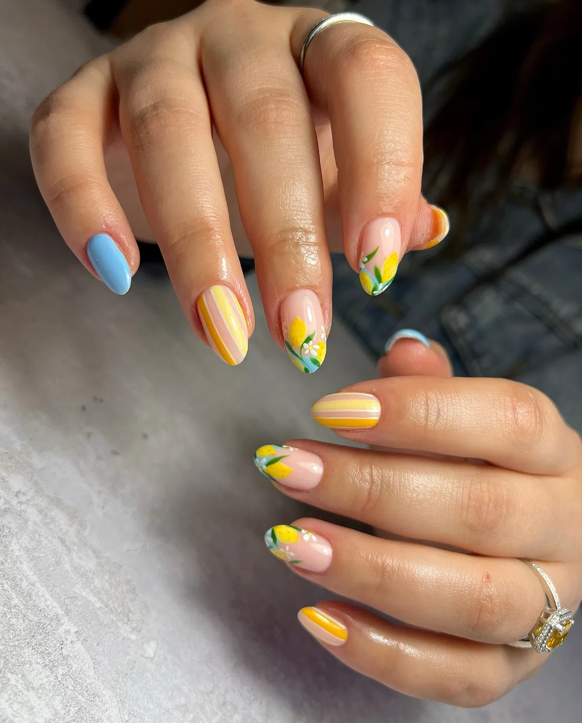 Striped accent with lemon-and-flower nail art