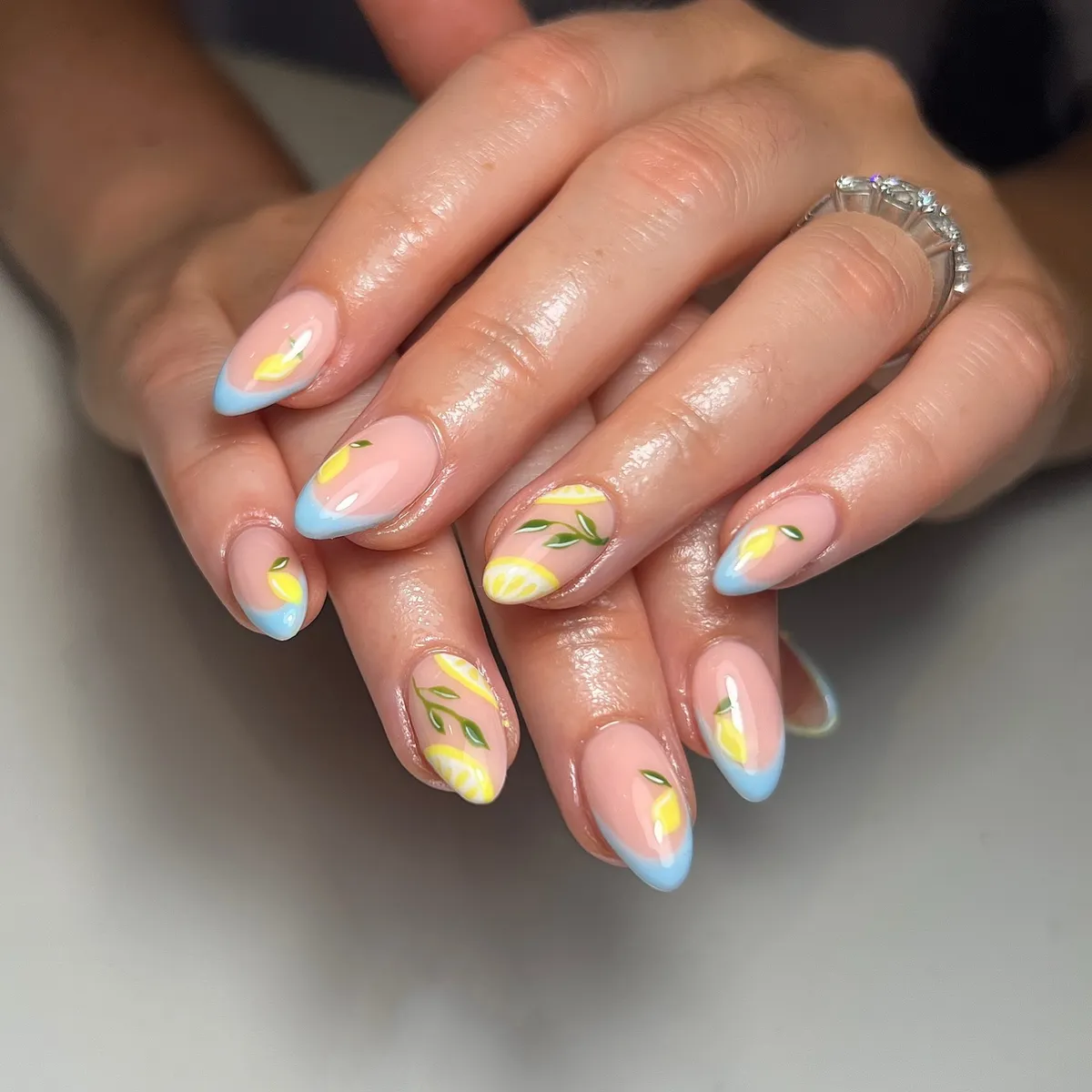 Blue French tips with small lemon accents