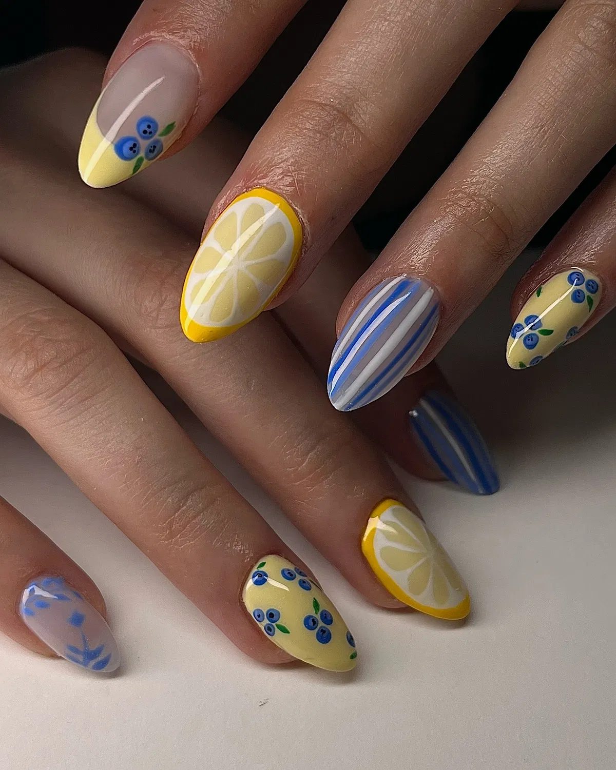 Lemon slices, blue stripes, and berry motifs