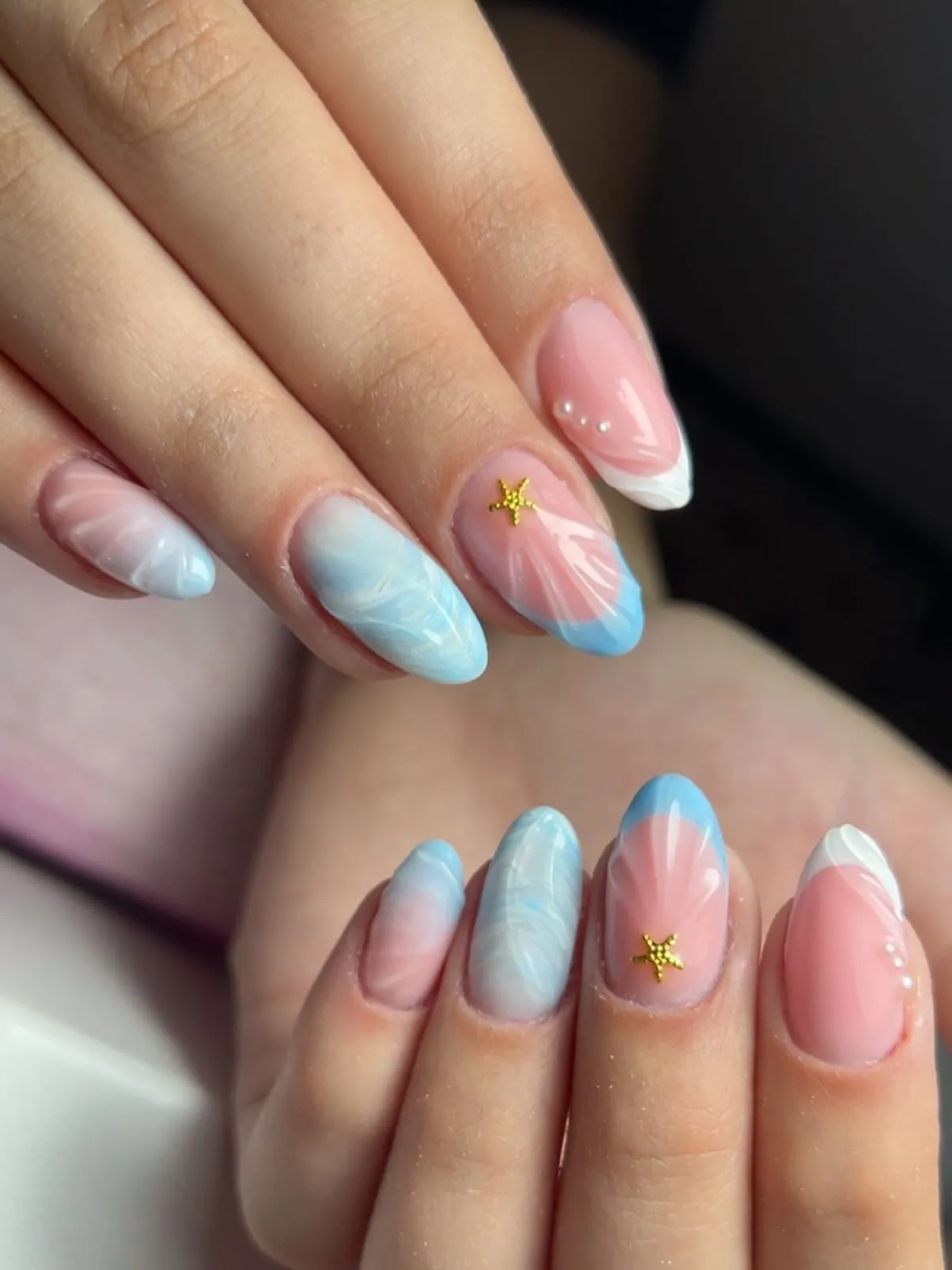 Pink-and-blue gradients with white tips and gold starfish charms