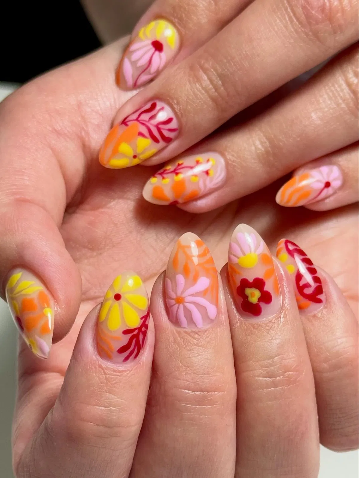 Sheer nude florals in warm pink, orange, and yellow