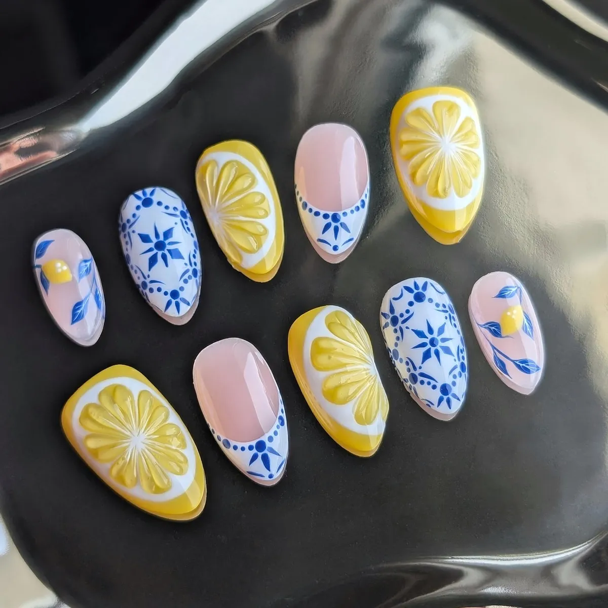 Mixed set display: raised-look citrus slices and blue patterns