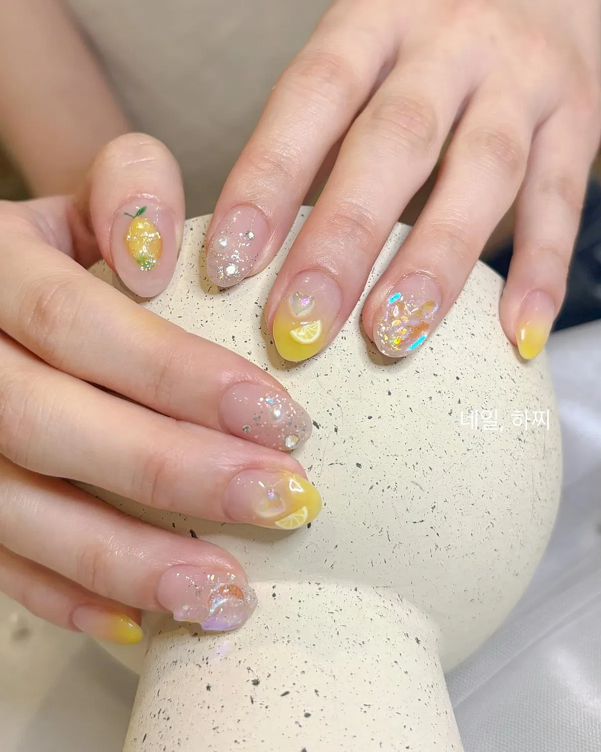 Sheer nude with glitter and yellow citrus-slice tips