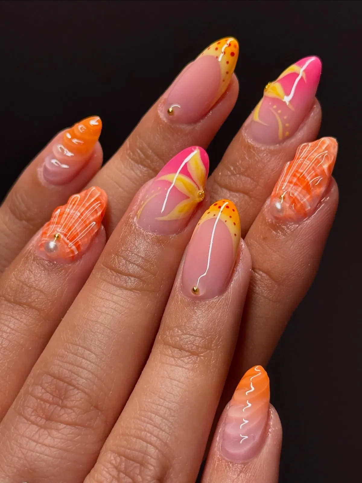 Almond neon tips with dotted accents and raised striped details