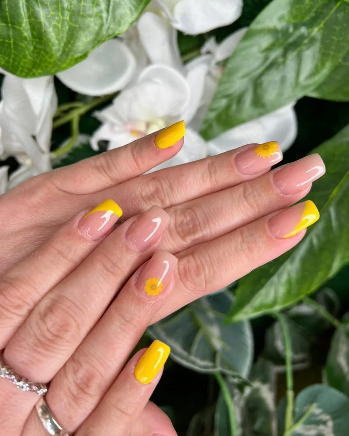 Yellow French tips with minimal sunflower details