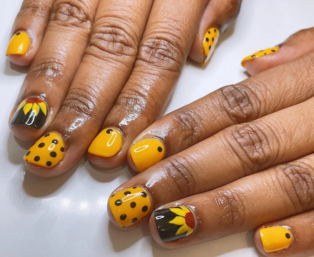 Short yellow polka dots with black sunflower accent nails