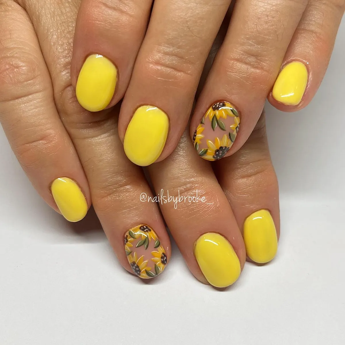 Solid yellow with all-over sunflower accent nails