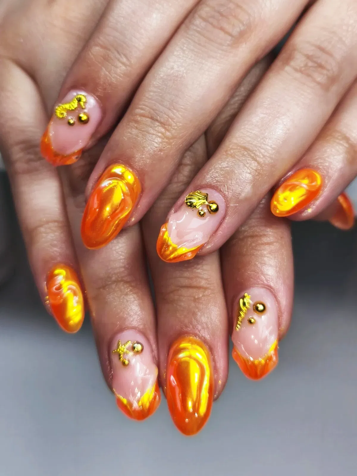 Orange Swirls with Gold Charms