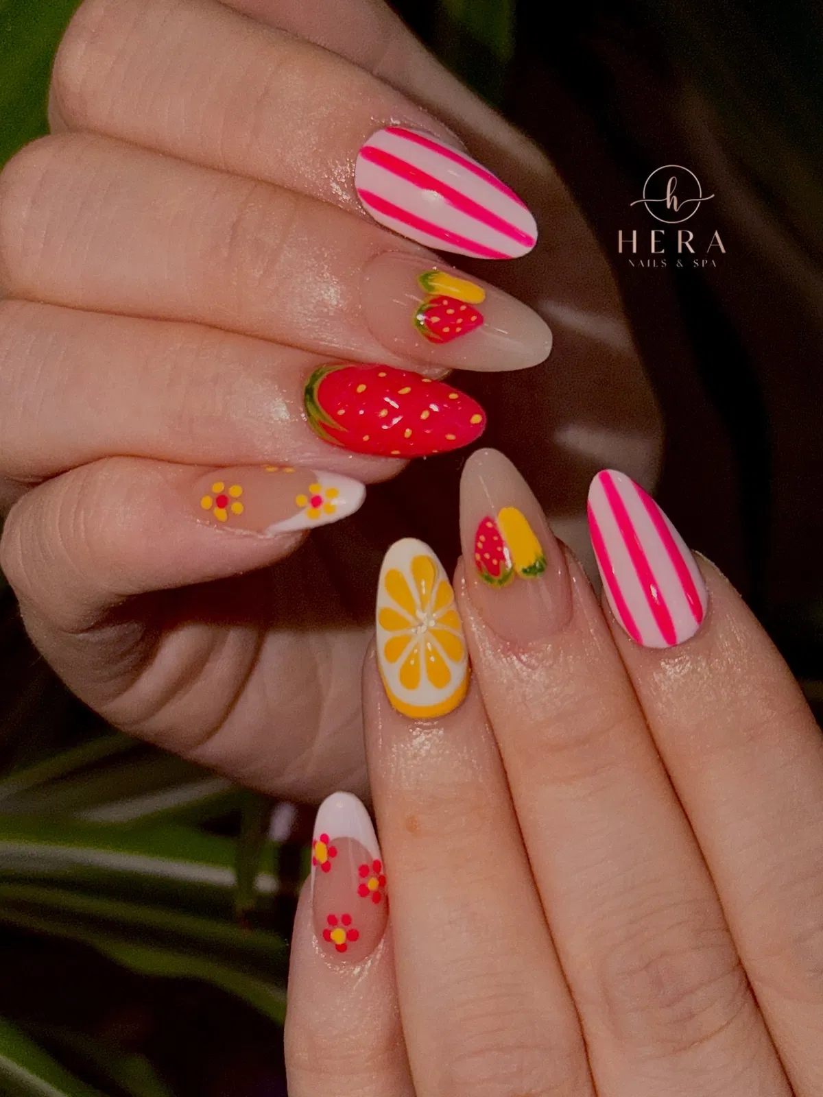 Striped pinks and citrus slice with additional fruit-and-flower art