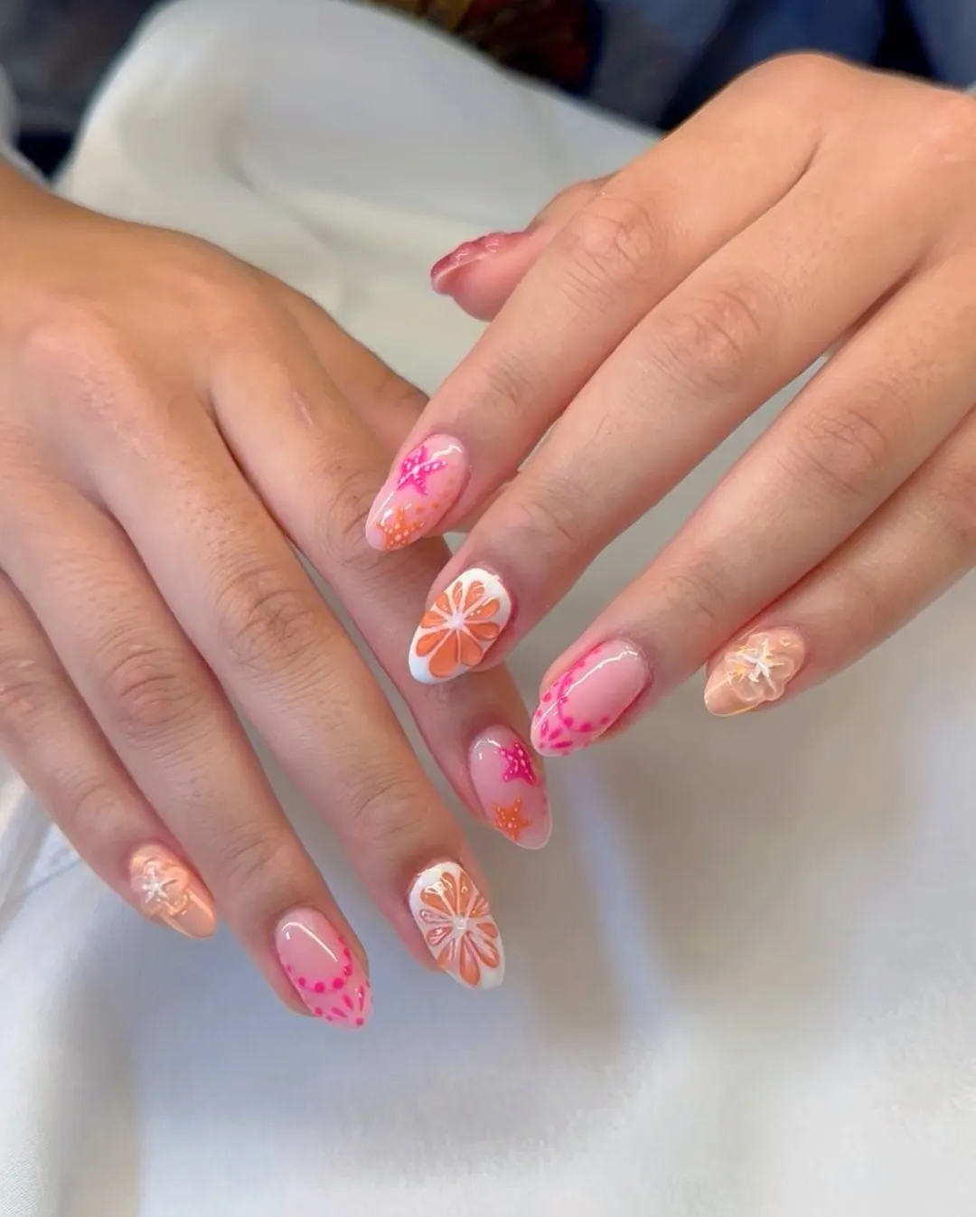 Neutral base with orange slice accents and pink dot detailing