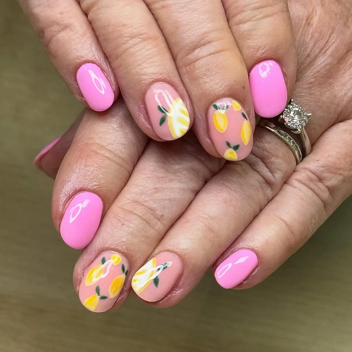 Glossy light pink with scattered lemon motifs