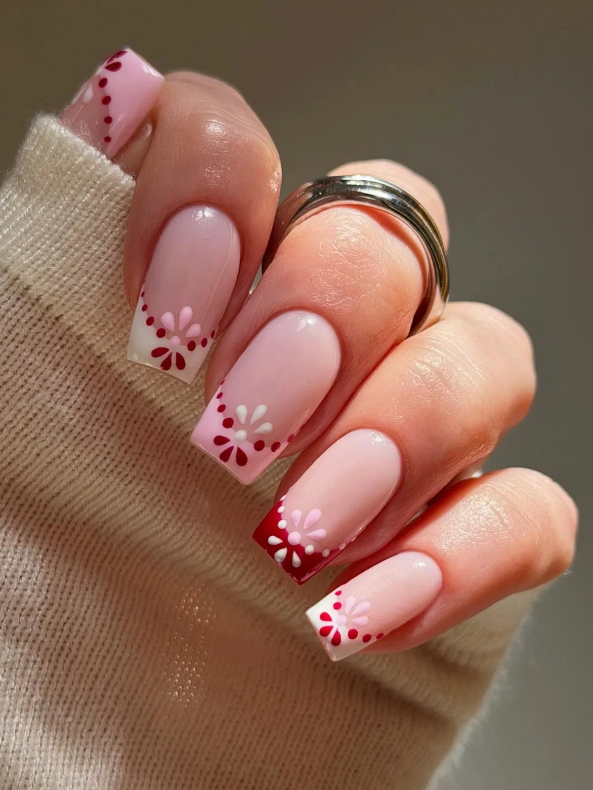 Square pink base with dotted floral French tips
