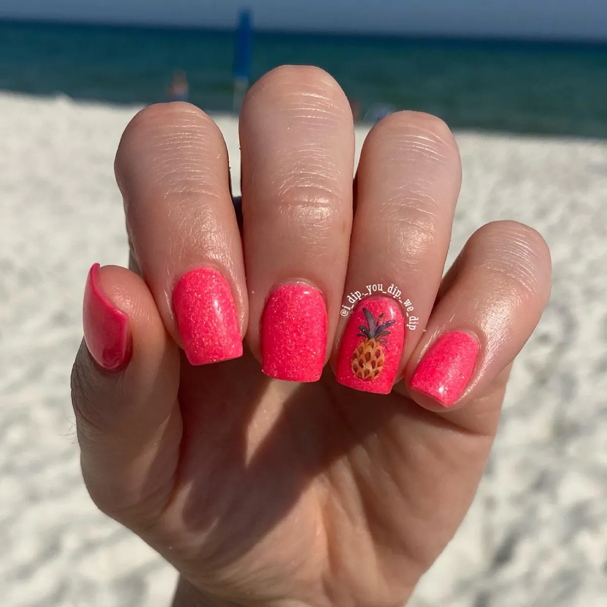 Glittery bright pink with a pineapple accent