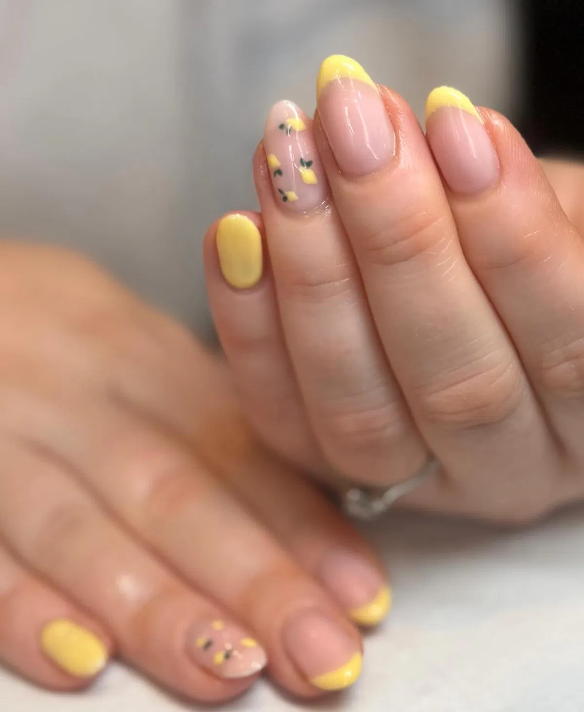 Yellow French tips with a small scattered lemon accent