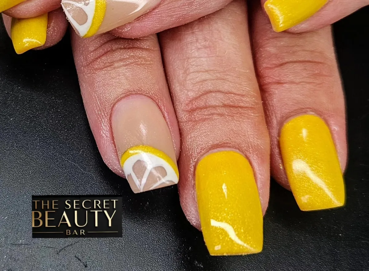 Shimmery yellow squares with a nude-and-white curved accent
