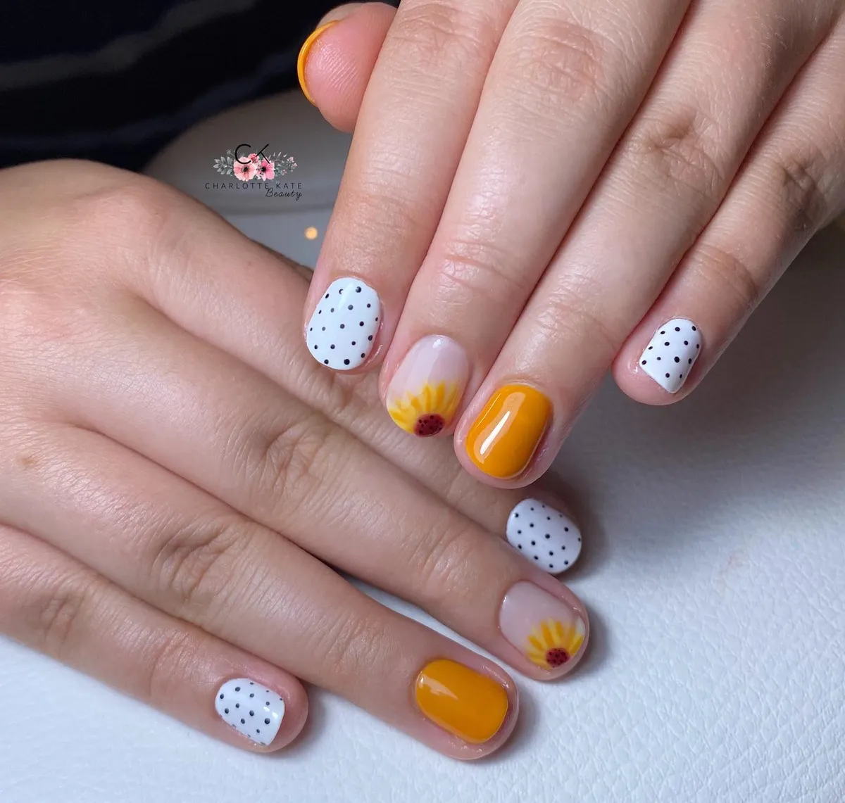 Polka dots with orange-yellow and sunflower-tip accents