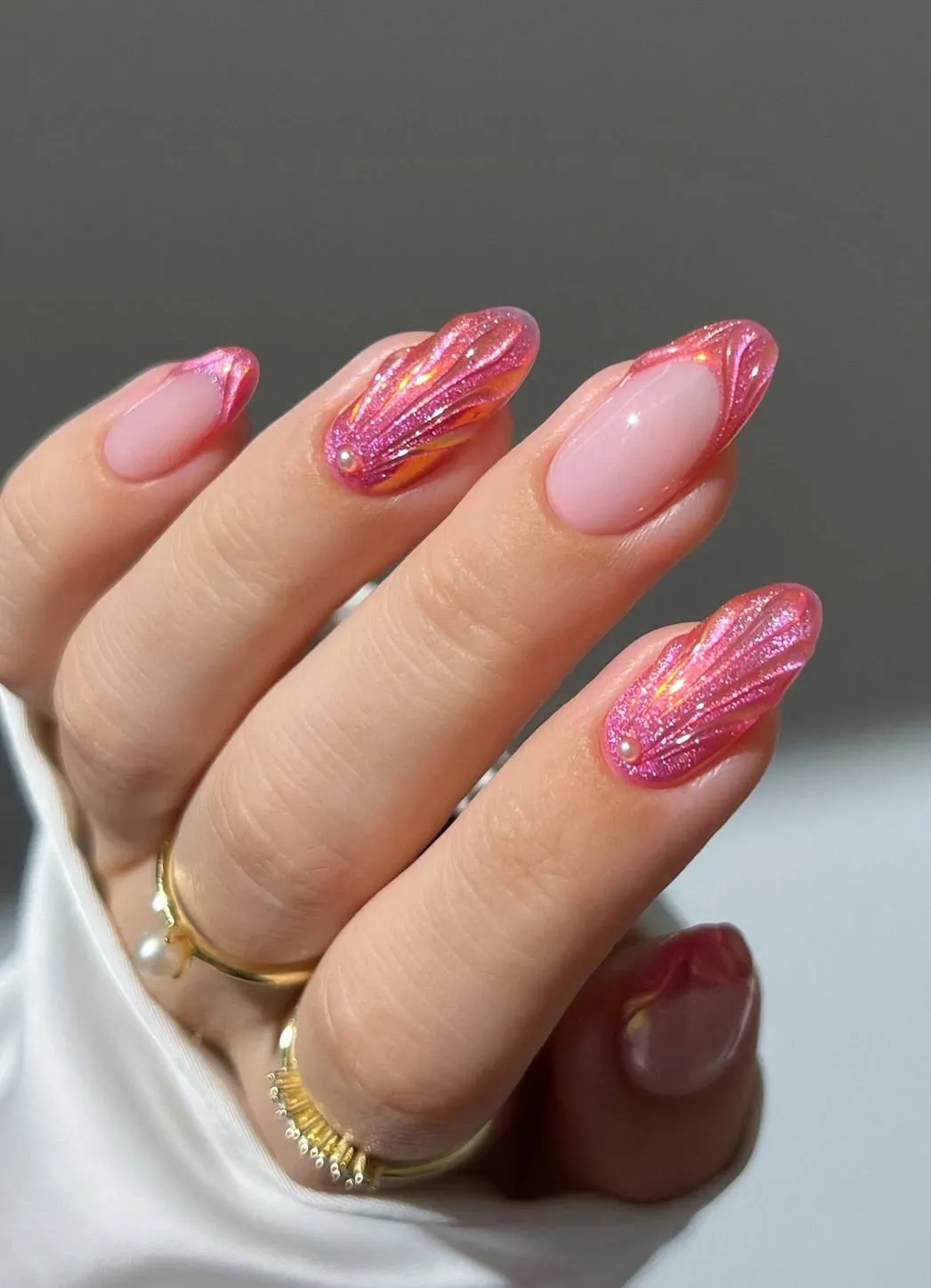 Pink shell-ridge accents with pearl detail