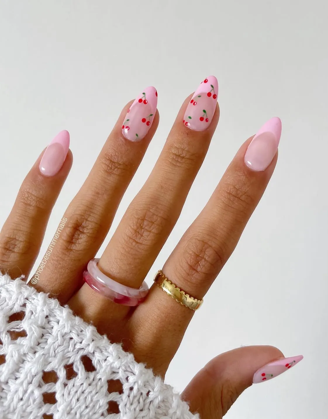 Minimal cherry accents on pale pink nails