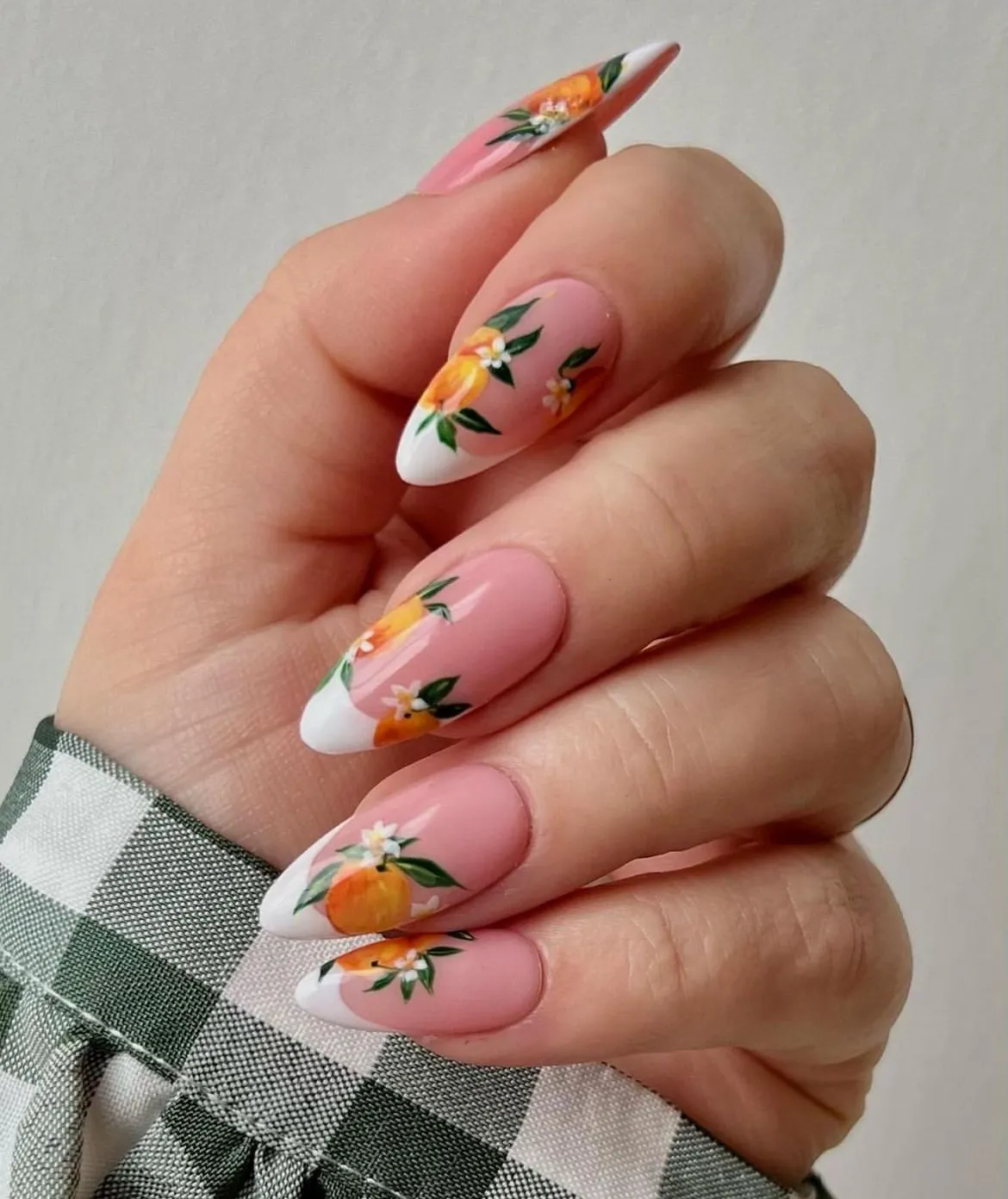 Pink French tips with orange-and-leaf art