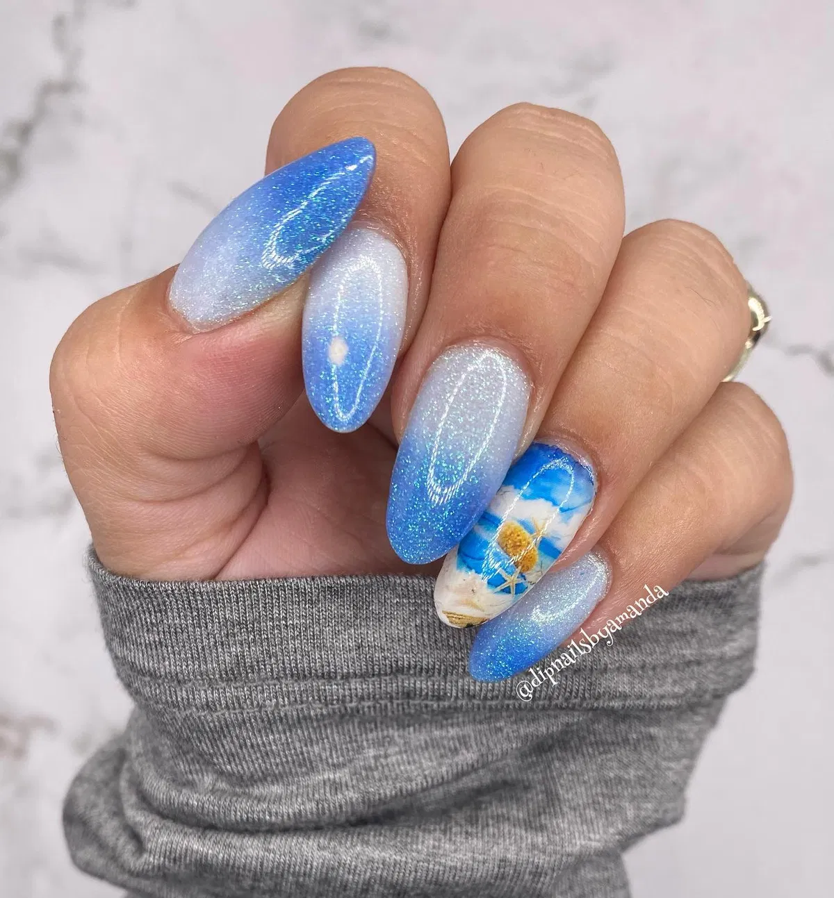 Shimmery blue ombré with a single illustrated accent